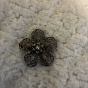 Beau Sterling silver filigree flower brooch.